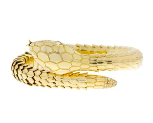 Yellow gold snake bracelet with diamond eyes and tail